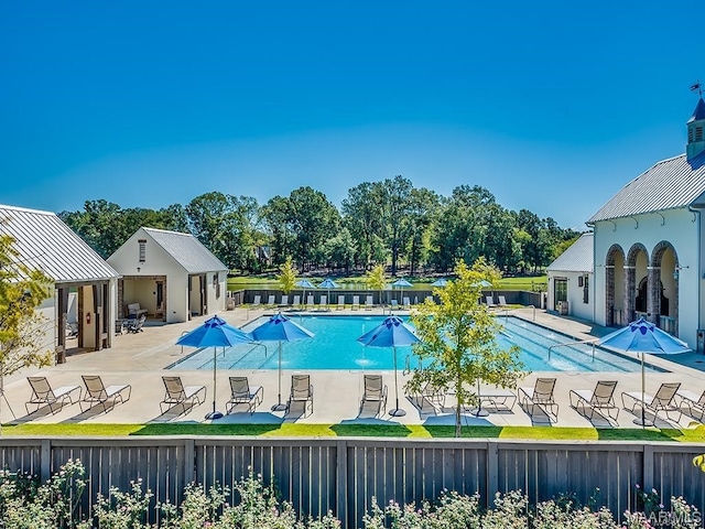 view of pool featuring a patio area