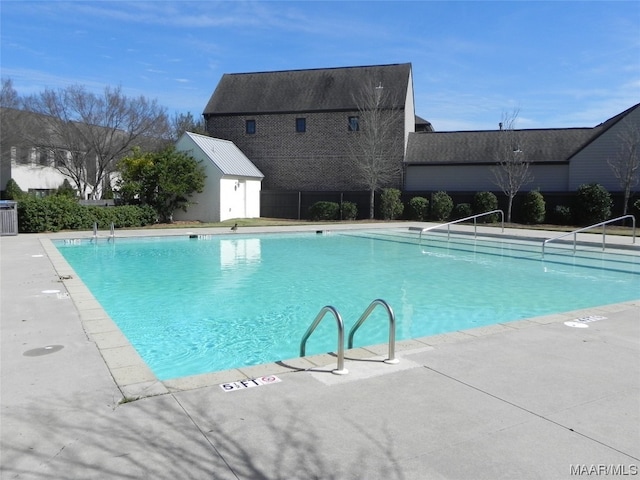 view of pool with an outdoor structure