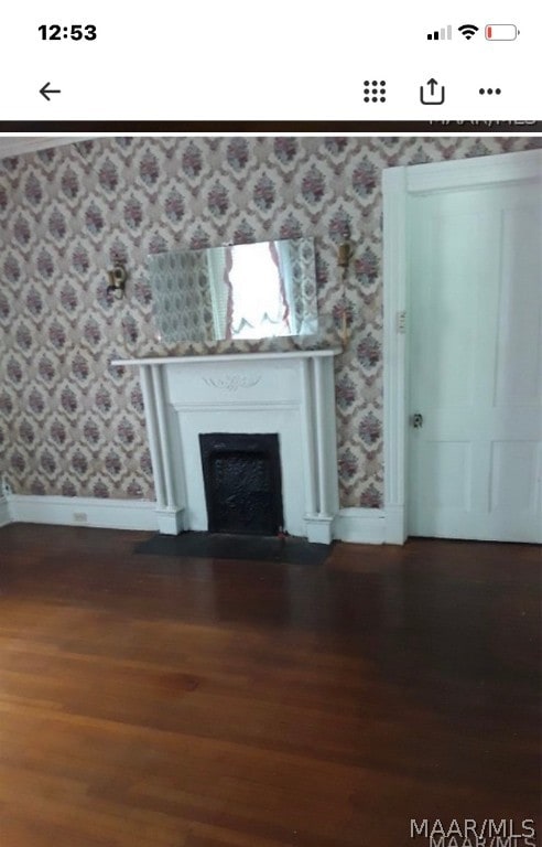 unfurnished living room featuring dark hardwood / wood-style flooring