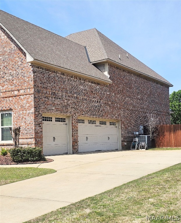 view of side of home with a garage