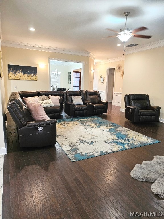 living room with ceiling fan, dark wood-type flooring, and ornamental molding