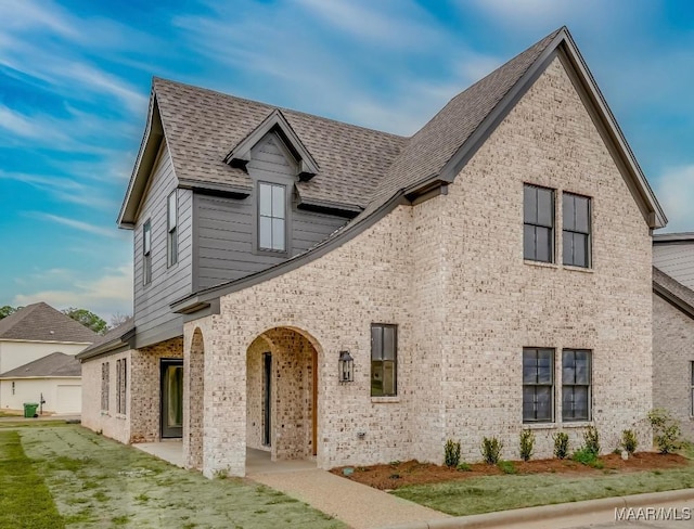 view of front of property with a front lawn and a patio