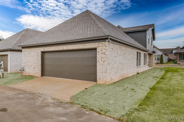 view of side of property with a lawn