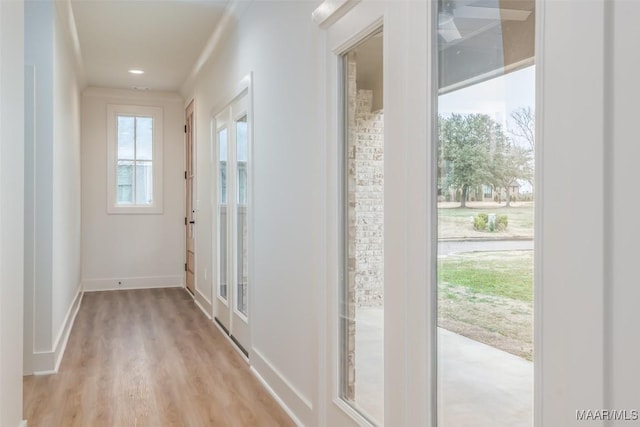 hallway with light wood-type flooring