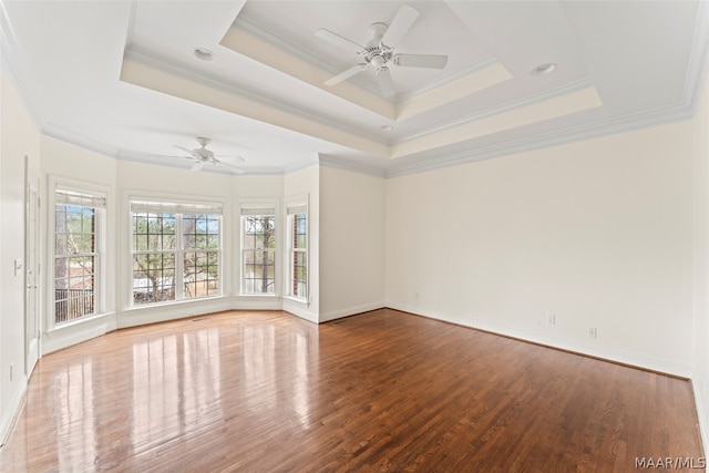 unfurnished room featuring ornamental molding and hardwood / wood-style flooring