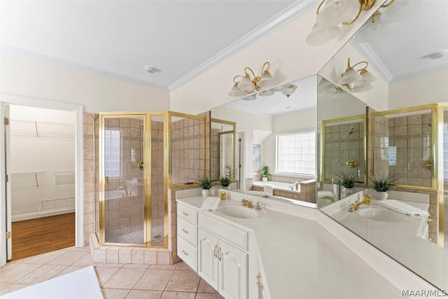 bathroom with vanity, tile patterned floors, a shower with shower door, and ornamental molding