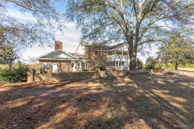 back of house with a sunroom