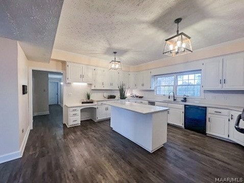 kitchen featuring black dishwasher, white cabinetry, a kitchen island, dark hardwood / wood-style floors, and hanging light fixtures