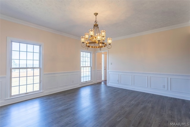 empty room featuring dark hardwood / wood-style flooring, a chandelier, and a healthy amount of sunlight