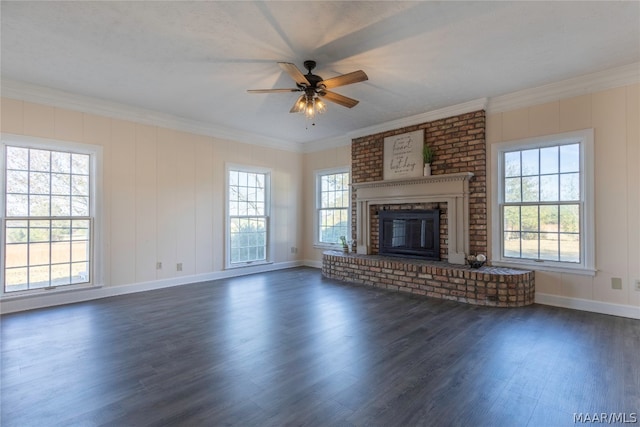 unfurnished living room featuring ceiling fan, dark wood-type flooring, and a brick fireplace