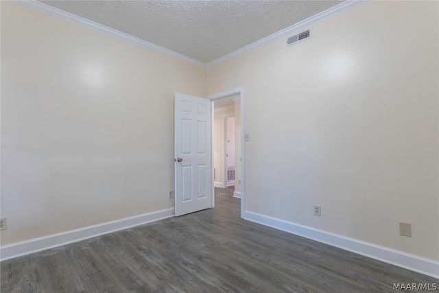 spare room with ornamental molding, dark wood-type flooring, and a textured ceiling