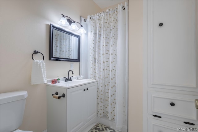 bathroom with toilet and oversized vanity