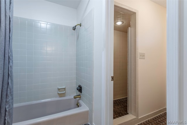 bathroom with shower / tub combo with curtain