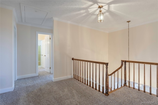 hallway featuring crown molding, a textured ceiling, and carpet