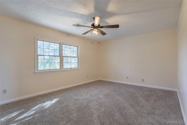 empty room with carpet flooring, a textured ceiling, and ceiling fan