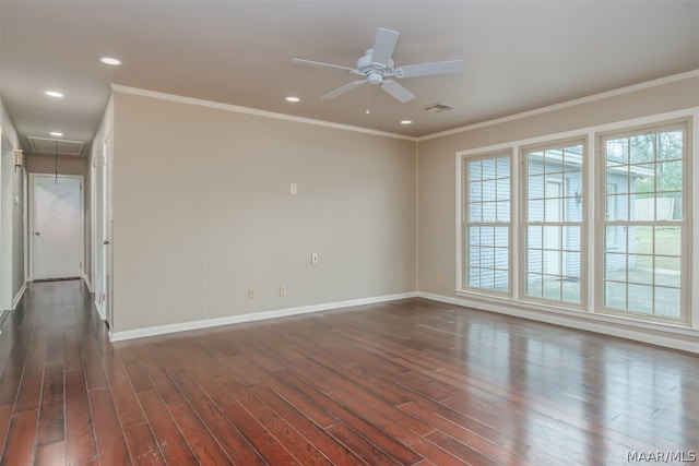 unfurnished room featuring ceiling fan, dark wood-type flooring, and a healthy amount of sunlight