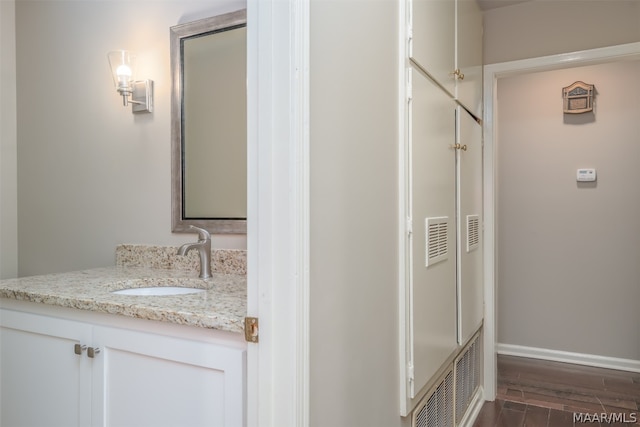 bathroom featuring vanity and hardwood / wood-style flooring