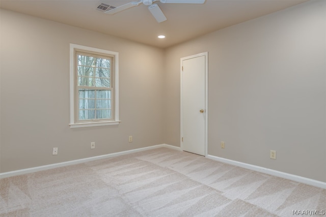 carpeted empty room with ceiling fan