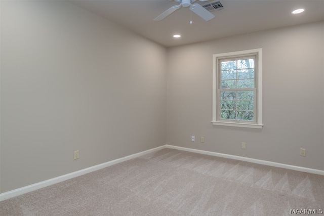 unfurnished room with light carpet and ceiling fan