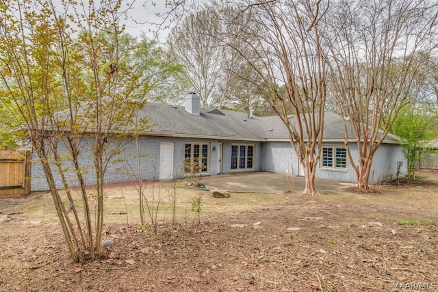 rear view of property featuring a patio and french doors