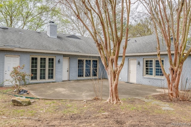 rear view of property featuring a patio