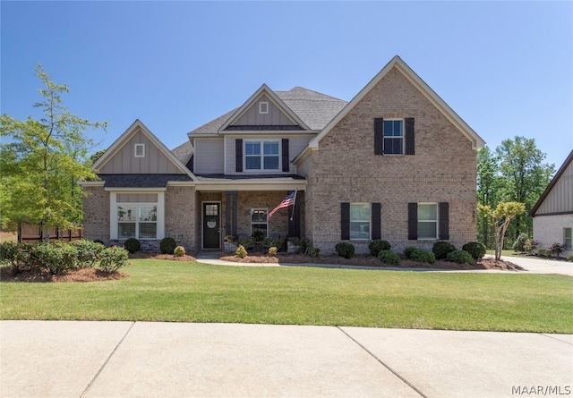 craftsman house with a front lawn