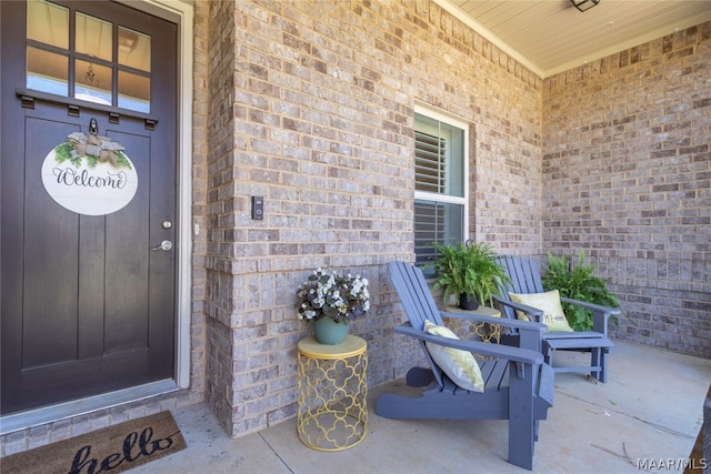 doorway to property featuring covered porch