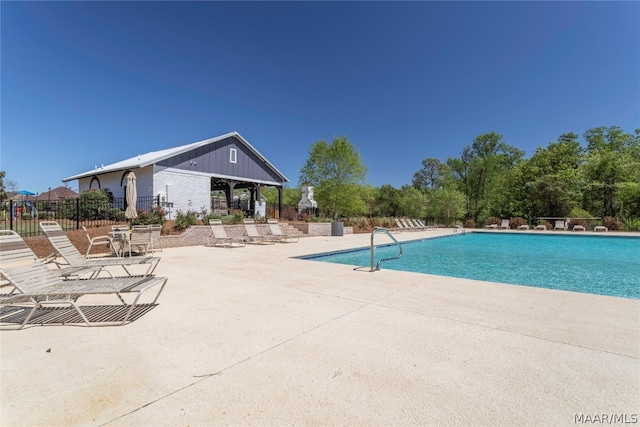 view of swimming pool with a patio area