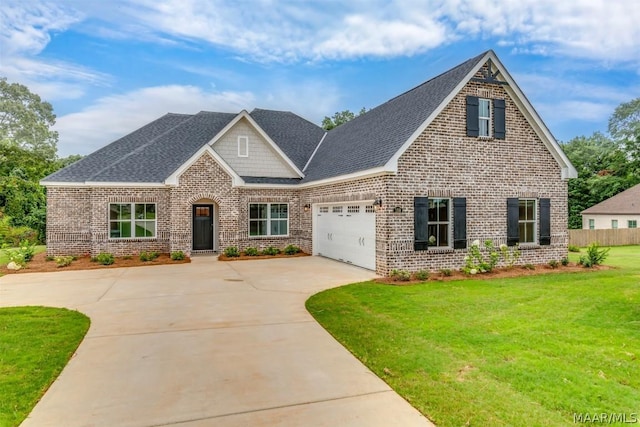 view of front of house with a front lawn and a garage