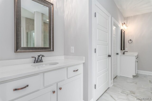 bathroom with an enclosed shower and vanity