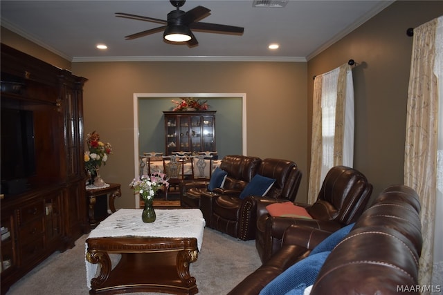 living room featuring carpet flooring, ceiling fan, and ornamental molding