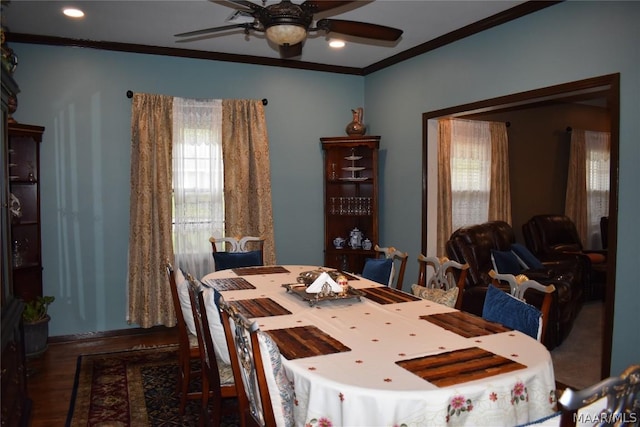 dining area with crown molding, ceiling fan, a healthy amount of sunlight, and wood-type flooring