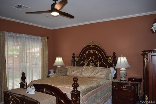 bedroom with ceiling fan and ornamental molding