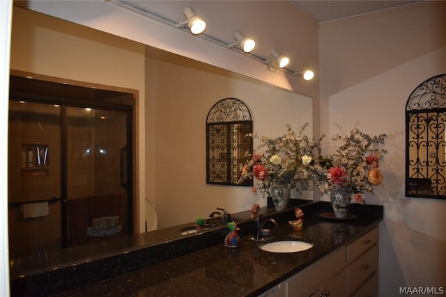 bathroom with vanity and an enclosed shower