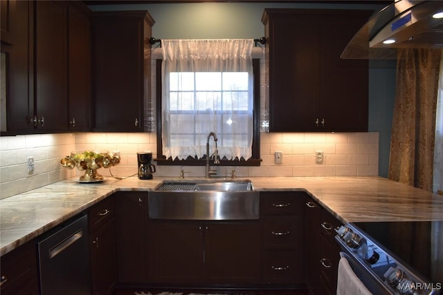 kitchen featuring dark brown cabinetry, sink, appliances with stainless steel finishes, and tasteful backsplash