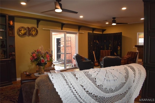 interior space with crown molding and ceiling fan