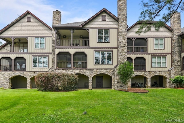 exterior space featuring a front yard and a balcony