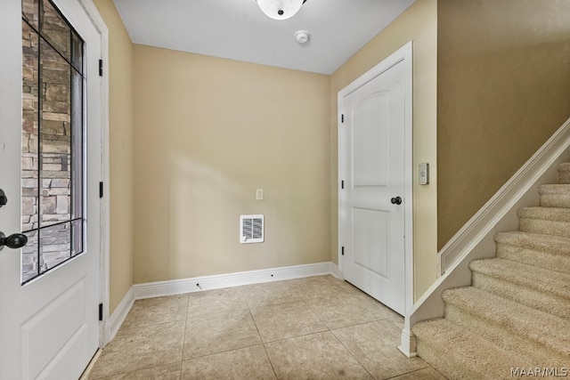 foyer entrance featuring light tile floors