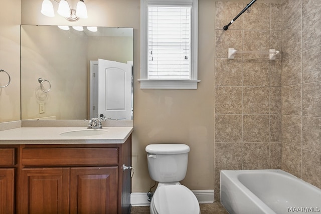 full bathroom with tiled shower / bath combo, tile floors, toilet, and vanity