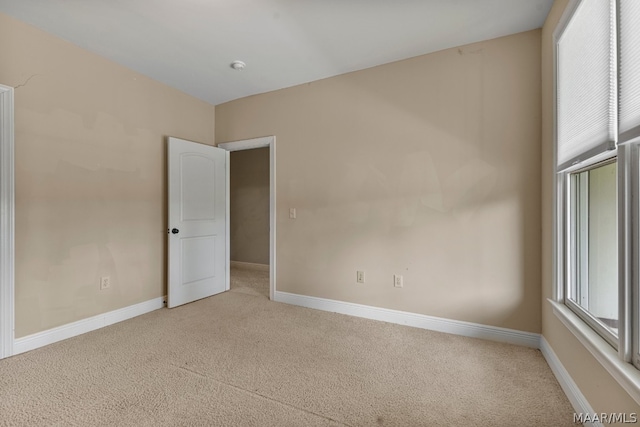 unfurnished room featuring carpet floors