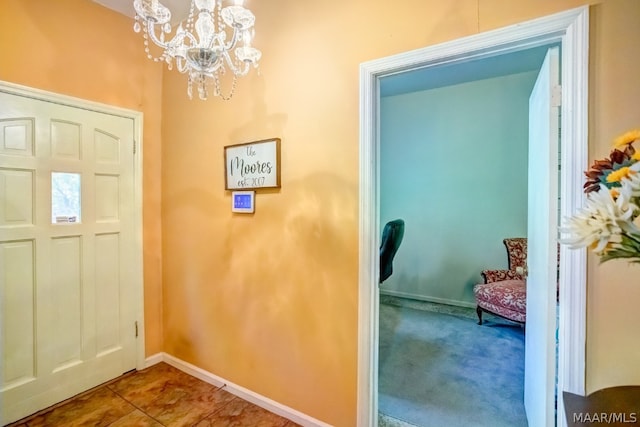 interior space featuring a notable chandelier and tile patterned floors