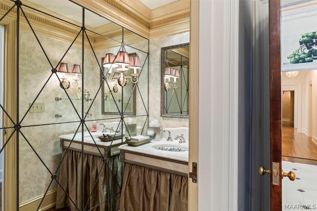 bathroom featuring vanity and wallpapered walls