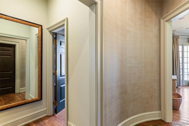 bathroom with baseboards and wood finished floors