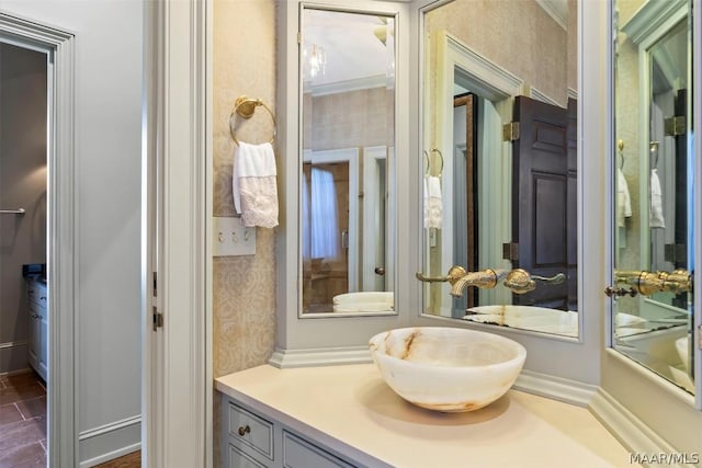 bathroom with vanity and wallpapered walls