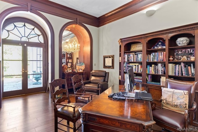 office area with arched walkways, ornamental molding, wood finished floors, french doors, and a chandelier