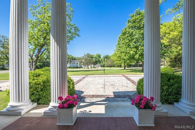 entryway with ornate columns