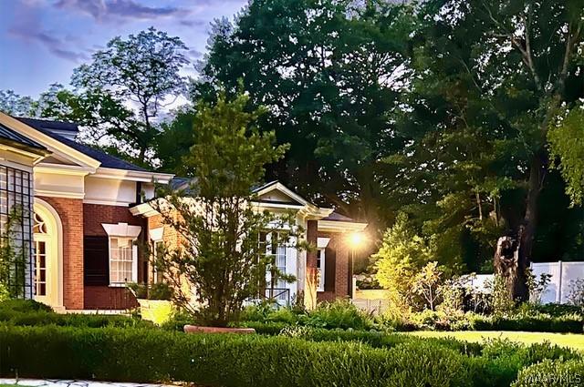 view of front of house with brick siding