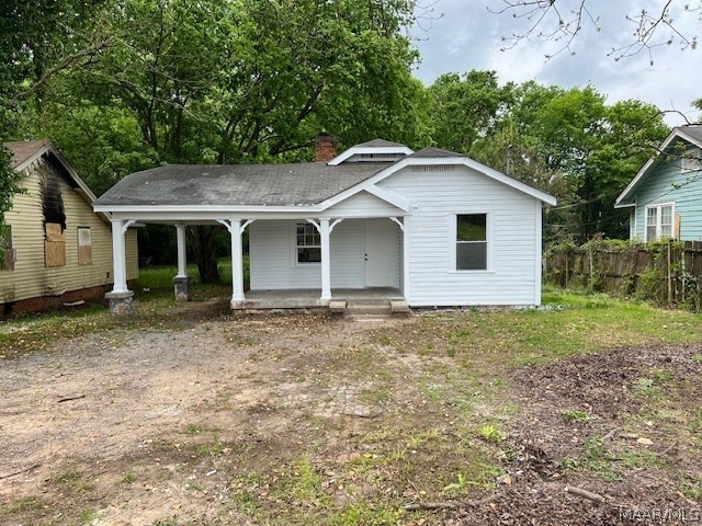 back of house with a porch