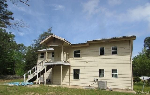 back of property with central AC