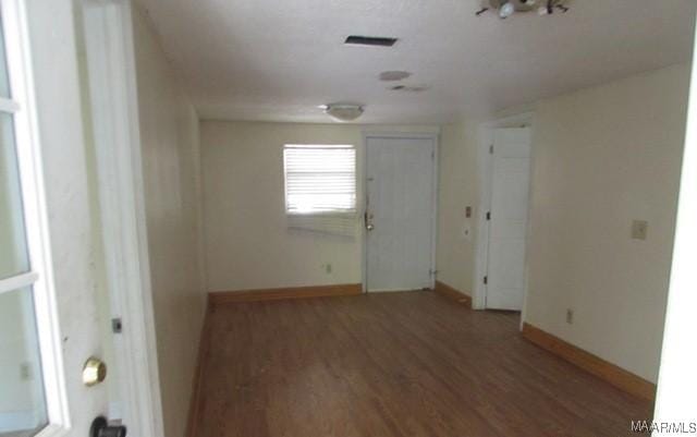 empty room featuring dark hardwood / wood-style floors